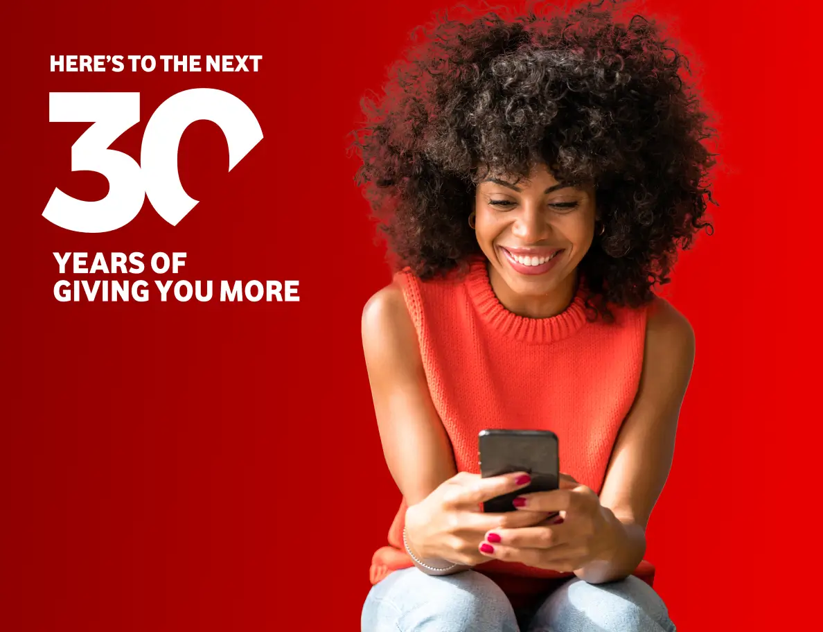 Image of a lady sitting and holding her phone