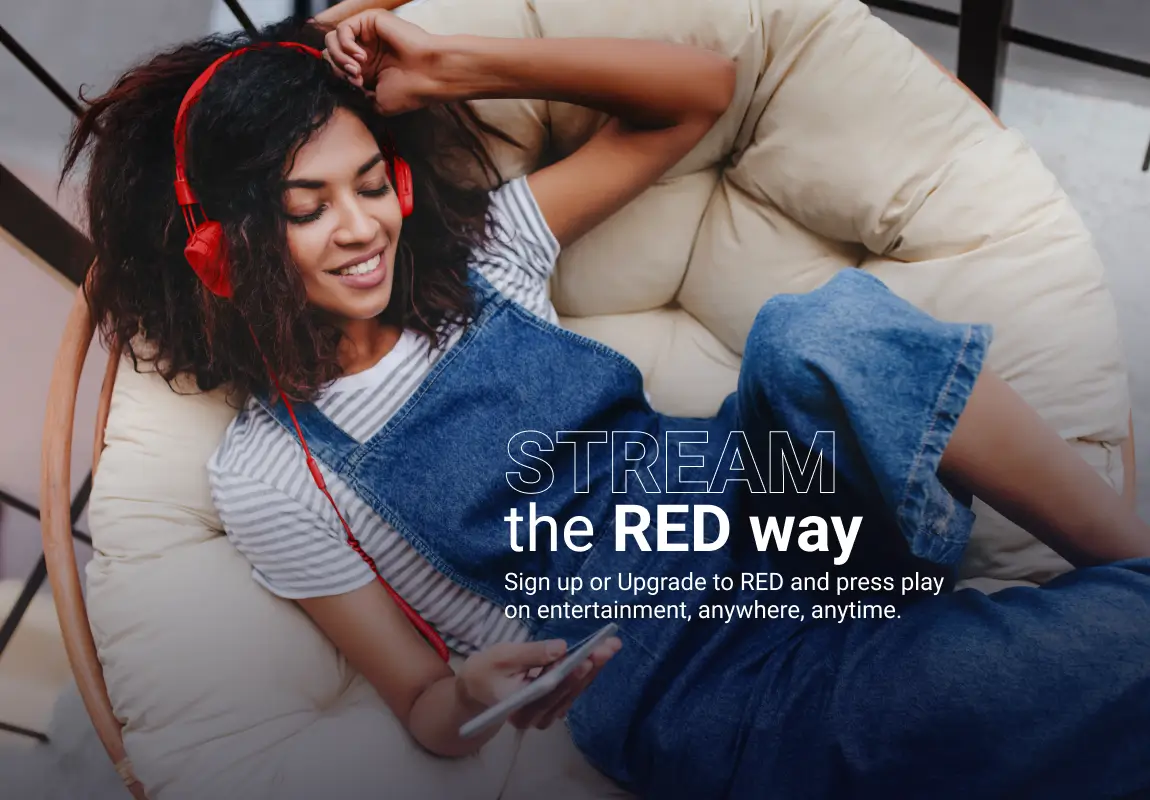 A women lying on couch listening to music