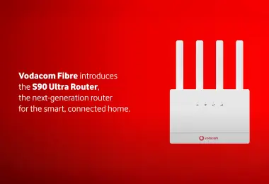 An advertisement for Vodacom Fibre featuring a white, four-antenna S90 Ultra Router against a solid red background. The text on the left reads: "Vodacom Fibre introduces the S90 Ultra Router, the next-generation router for the smart, connected home." The Vodacom logo is visible at the bottom of the router.